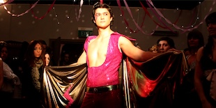 Murray holding up sparkling cape